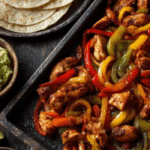 30 Minute Sheet Pan Chicken Fajitas on rustic counter