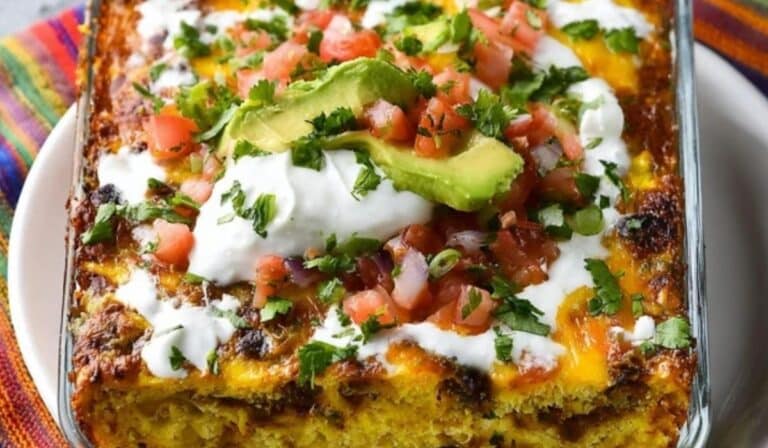 Mexican Breakfast Casserole with cheese and chorizo in a rustic baking dish