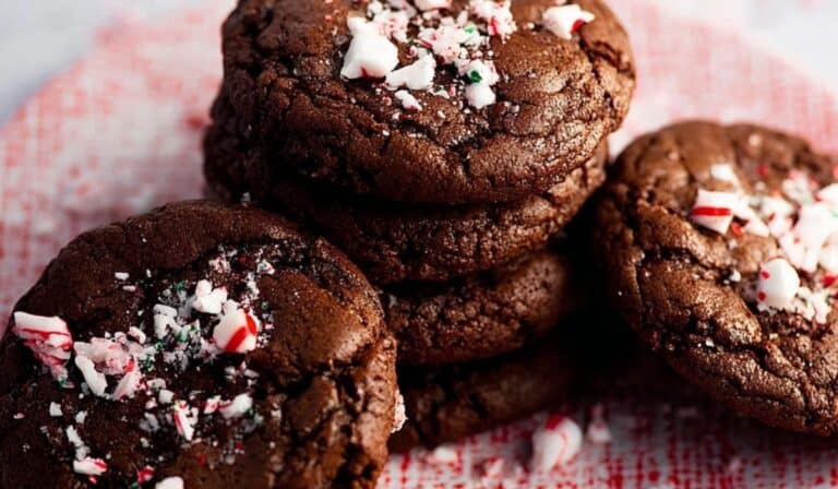 Peppermint brownie cookies with candy cane topping on festive plate