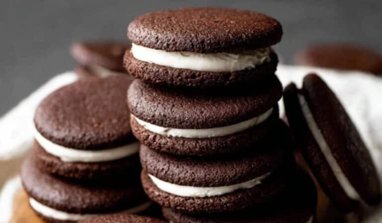 Homemade Oreos stacked on rustic plate