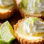 Mini Key Lime Pies with whipped cream and lime zest