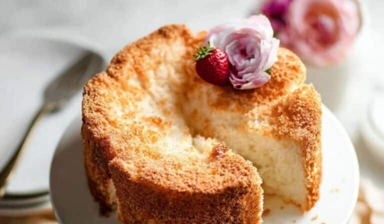 Angel Food Cake on cake stand with soft golden crumb