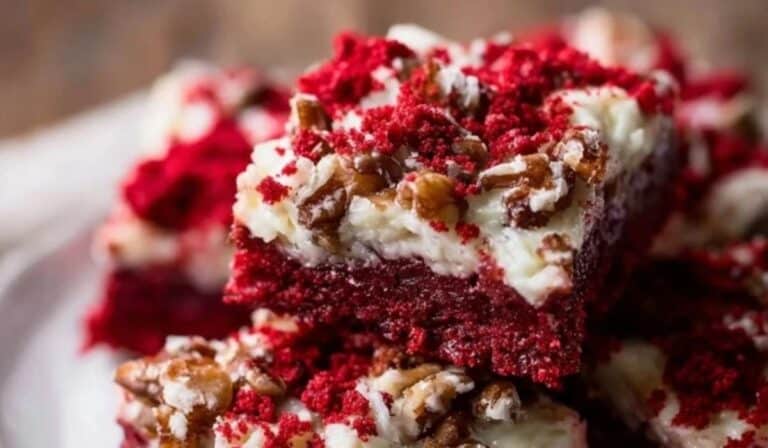 Red Velvet Layer Bars on a wooden table