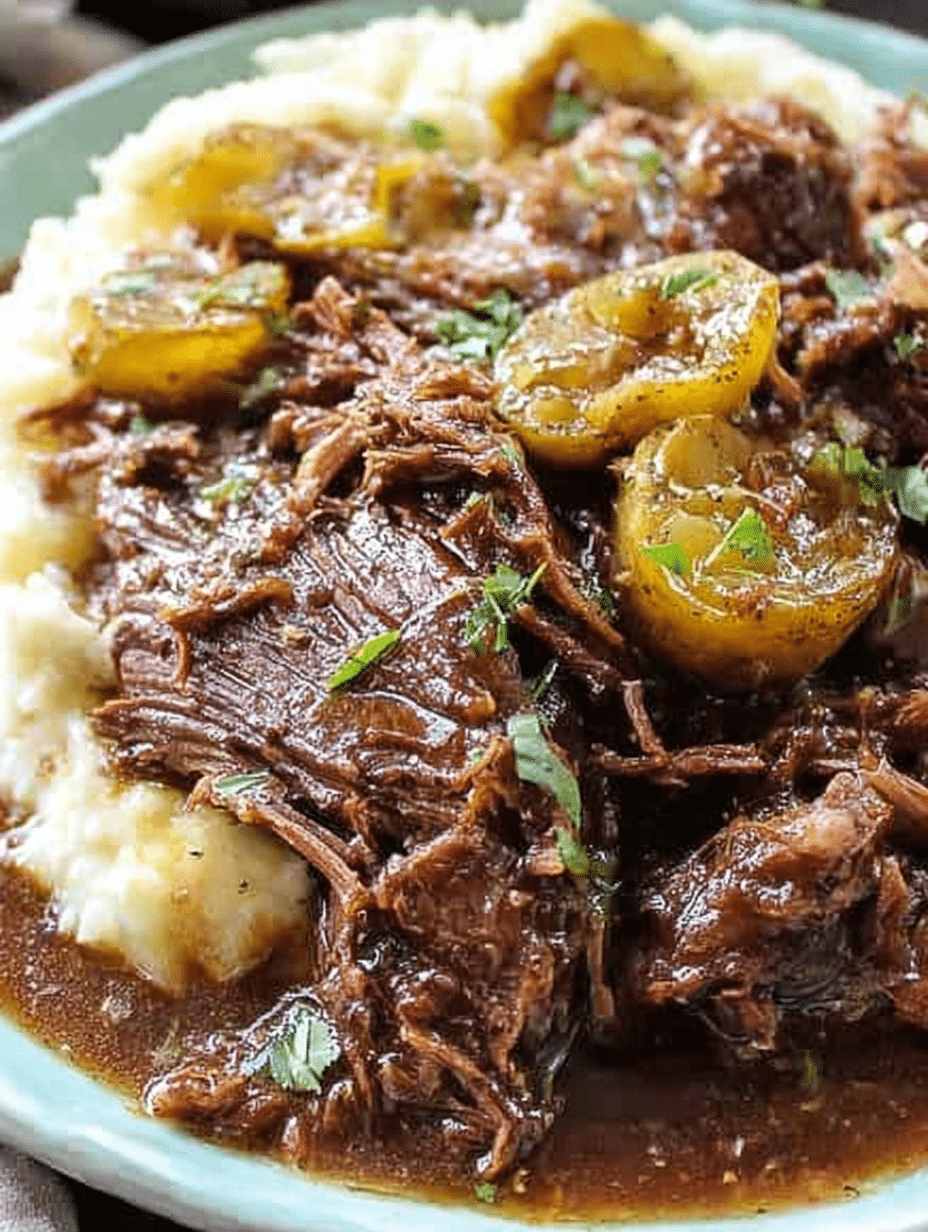 Delicious Mississippi Pot Roast on a plate with pepperoncini peppers, served on a rustic wooden table.